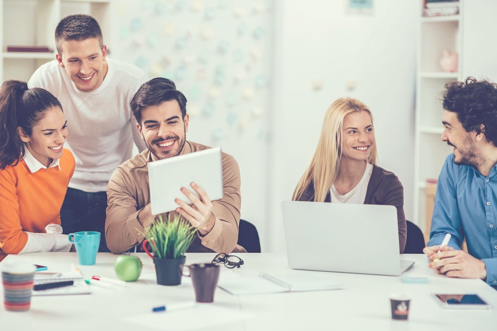 Corporate training classroom with workers studying together