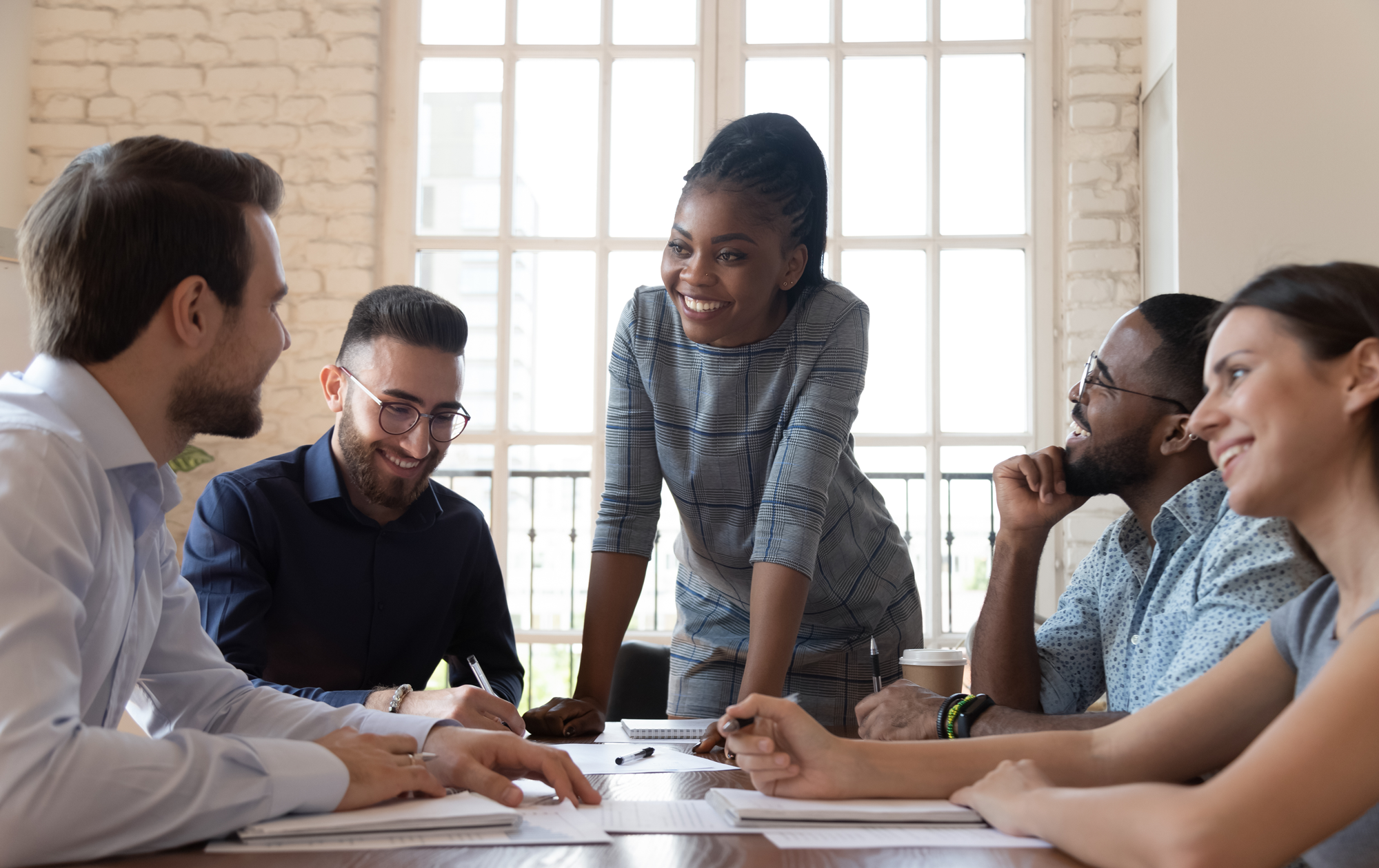 Woman_Leading_Business_Meeting-e1727377027689